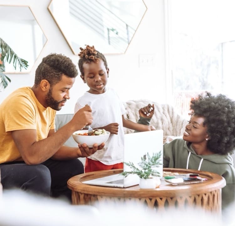 Shop ShoppyShop through Iris J Hill-Baker at Wealth Health Beauty Shop Family sitting around a table eating and using products purchased at ShoppyShop through Iris J Hill-Baker at Wealth Health Beauty Shop